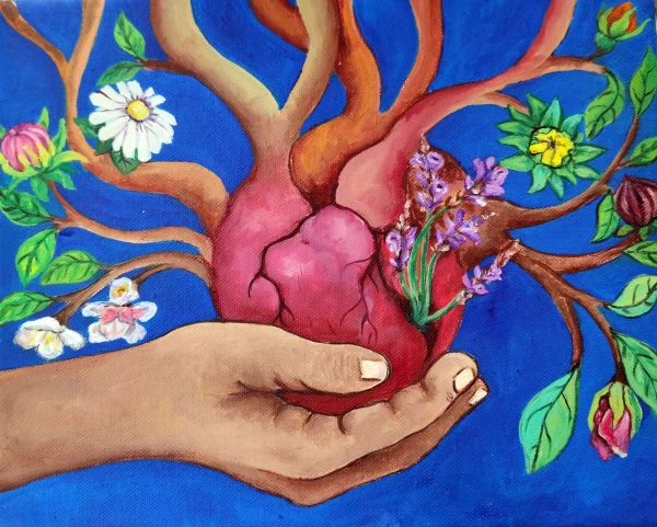 A hand holds a heart from which flowers bloom. Symbolizing emotional wounds from which flowers of healing emerge.